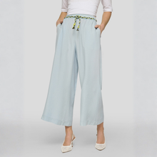 Load image into Gallery viewer, Light blue wide-leg pants with a tie waist on a white background
