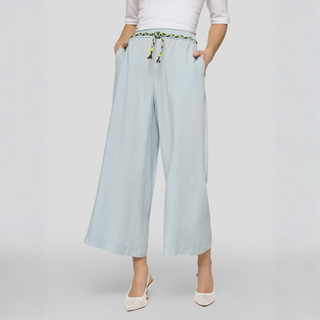 Light blue wide-leg pants with a tie waist on a white background