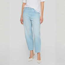 Load image into Gallery viewer, Light blue jeans worn by a person on a plain background

