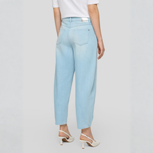 Load image into Gallery viewer, Light blue jeans worn by a person on a plain background
