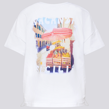 Load image into Gallery viewer, White t-shirt with a colorful street market design on a white background
