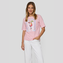 Load image into Gallery viewer, Woman wearing a red and white striped t-shirt with a graphic design on a plain background
