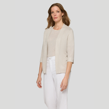 Load image into Gallery viewer, Woman wearing a beige cardigan over a white top and pants on a light gray background
