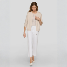 Load image into Gallery viewer, Woman wearing a beige jacket and white pants on a light gray background
