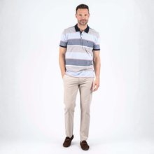 Load image into Gallery viewer, Man wearing a striped polo shirt and beige pants on a white background
