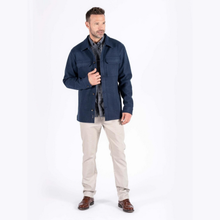 Load image into Gallery viewer, Model is wear patterned blue shirt, light grey trousers, brown shoes and dark petrol blue overshirt in a white background.

