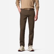 Load image into Gallery viewer, A model wearing brown slim-fit chinos, styled with a tan sweater, a leopard-print belt, and beige sneakers, shown from the waist down on a light gray background.

