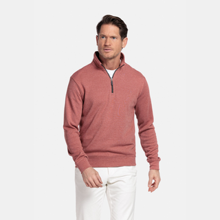 Man wearing a pink half-zip sweatshirt on a white background