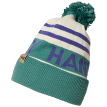 Load image into Gallery viewer, A knit pom-pom beanie hat in teal green, white, and purple, featuring a large 'HANS' text design on the side and a small brown leather 'HH' brand tag on the cuff.
