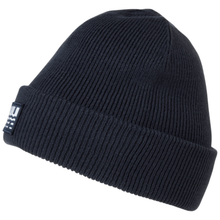 Load image into Gallery viewer, A dark navy blue ribbed knit beanie hat with a folded cuff, featuring a small white and navy brand patch on the side, set against a plain white background.
