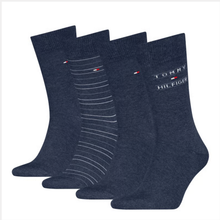 Load image into Gallery viewer, Set of four dark blue socks with Tommy Hilfiger branding on a white background
