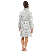 Load image into Gallery viewer, Model facing away from the camera wearing a morning gown with pockets, a waist tie and a black and white animal print
