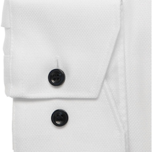 Load image into Gallery viewer, Close-up of a white dress shirt with black buttons on a white background
