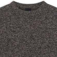 Load image into Gallery viewer, Close-up of a crew-neck knit sweater in a dark heathered melange of black and warm beige/tan threads, showing the textured fabric and collar.
