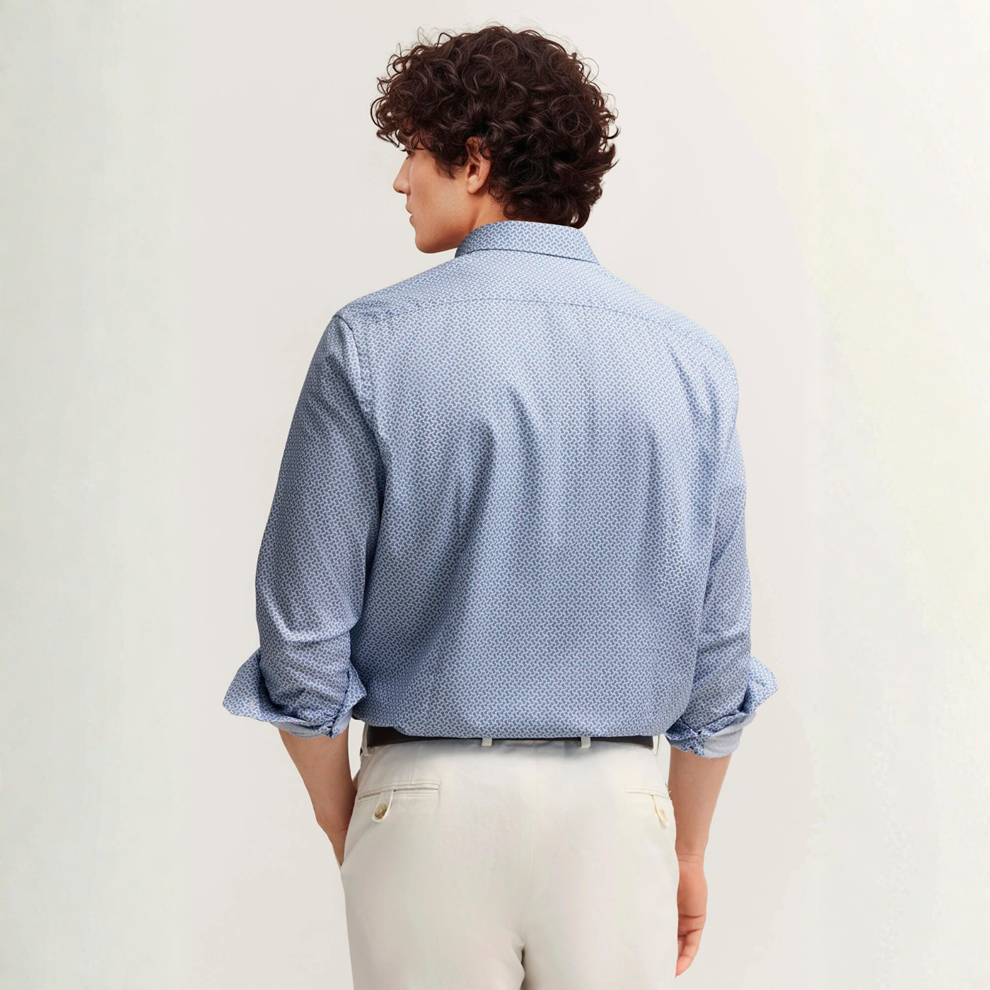 Load image into Gallery viewer, Person wearing a blue patterned shirt and light-colored pants on a plain background