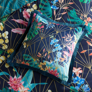 Aloria Botanical Cushion on matching bedcover with Botanical scene on Navy background with Gold Stem detail 