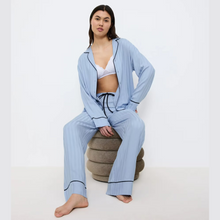Load image into Gallery viewer, Model seated in PJ Set 
