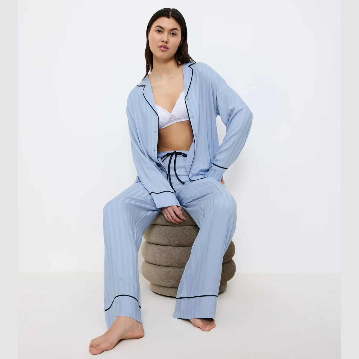Model seated in PJ Set 
