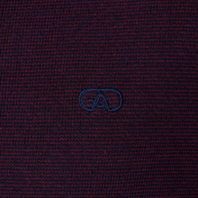 Load image into Gallery viewer, Close-up of a dark red fabric with a blue logo on a matching background
