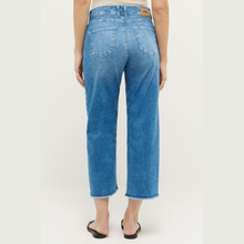 Load image into Gallery viewer, Blue jeans worn by a person on a white background
