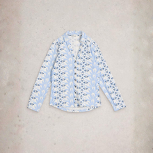 Load image into Gallery viewer, Light blue patterned shirt on a beige surface
