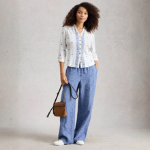 Load image into Gallery viewer, Full view of model wearing White Stuff Annie Jersey Shirt, White Print, with a light grey background.
