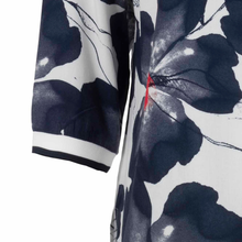 Load image into Gallery viewer, Close up of sleeve on Squesto V-neck Navy Floral Blouse
