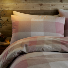 Load image into Gallery viewer, Checkered bedspread and pillows on a wooden headboard
