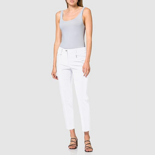 Model wearing a pair of cigarette style white gardeur trousers, front facing