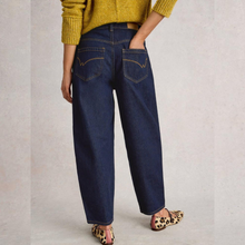 Load image into Gallery viewer, Person wearing blue jeans and a yellow sweater on a plain background
