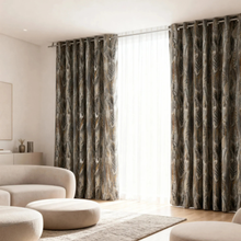 Load image into Gallery viewer, Living room with patterned curtains and modern furniture
