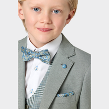 Load image into Gallery viewer, Young boy wearing a gray suit with a patterned bow tie and pocket square on a light gray background
