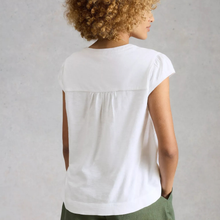 Load image into Gallery viewer, Person wearing a white sleeveless top with a neutral background
