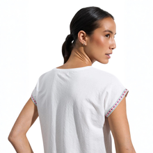 Load image into Gallery viewer, Woman wearing a white top with colorful sleeves on a white background

