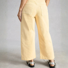 Load image into Gallery viewer, Person wearing light yellow pants on a plain background
