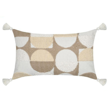 Load image into Gallery viewer, Rectangular decorative throw pillow with a geometric pattern of beige, cream, and taupe circles and half-circles, finished with four white tassels at the corners, shown on a solid white background.
