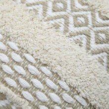 Load image into Gallery viewer, Close-up of a woven textile with two distinct textures: a chunky cream bouclé section and a smooth beige geometric diamond patterned section.
