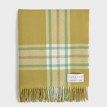 Load image into Gallery viewer, A folded plaid throw blanket in olive green, cream, and mint green, featuring a woven texture and fringed edges, with a white Foxford brand label on the lower right.
