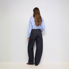 Load image into Gallery viewer, Rear of jean on Model with shirt 
