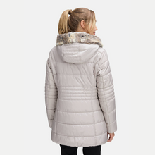 Load image into Gallery viewer, Woman wearing a light gray quilted jacket with a fur-lined hood on a white background
