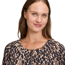 Load image into Gallery viewer, Woman wearing a leopard print top on a white background
