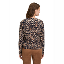 Load image into Gallery viewer, Woman wearing a patterned long-sleeve top and brown pants on a white background

