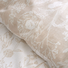 Load image into Gallery viewer, Close-up of beige fabric with white floral pattern
