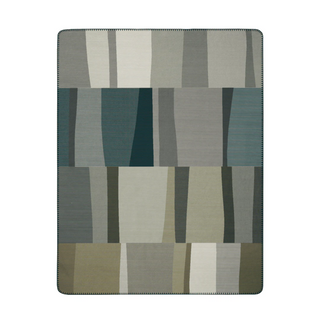Rectangular rug with a geometric pattern of squares in various shades of gray and green on a white background.