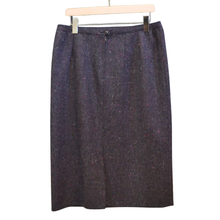 Load image into Gallery viewer, Dark gray skirt on a hanger against a white background
