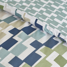 Load image into Gallery viewer, Geometric patterned fabric with blue, green, and white design
