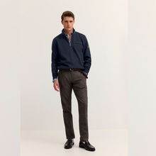 Load image into Gallery viewer, Model with Navy Jumper with grey trousers on white background 
