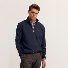 Load image into Gallery viewer, Model in Navy jumper with grey trouser on white background 
