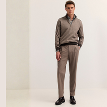 Load image into Gallery viewer, A man modeling a taupe brown quarter-zip sweater with black ribbed trim, paired with matching taupe trousers and black dress shoes, standing against a clean off-white studio background.
