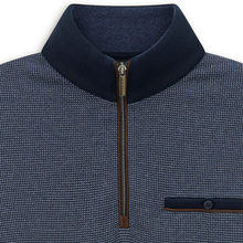 Load image into Gallery viewer, Close-up of a men's quarter-zip pullover sweater with a textured navy and blue micro-pattern, a solid navy stand collar, and a dark brown zipper pull.
